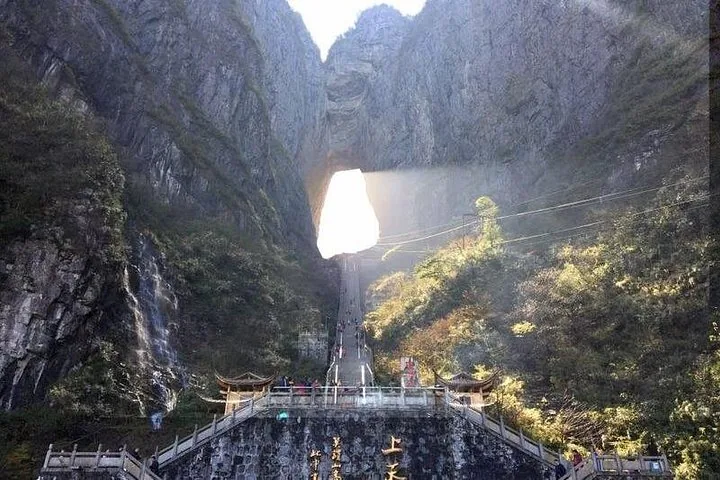 Sunlight shining through Tianmen Cave above the Stairway to Heaven