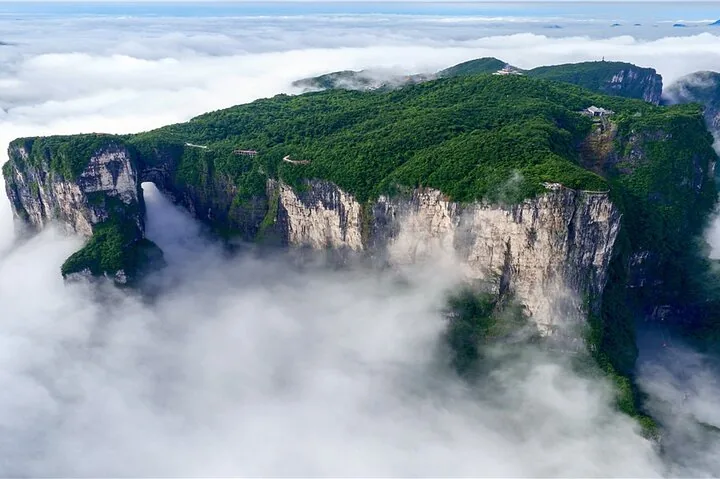 Aerial view of Tianmen Mountain plateau surrounded by sea of clouds