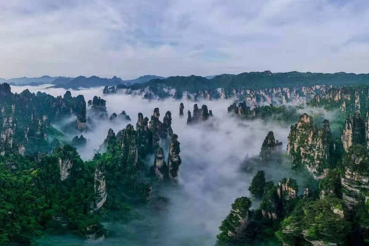 Sea of clouds surrounding the sandstone peaks in Wulingyuan Scenic Area